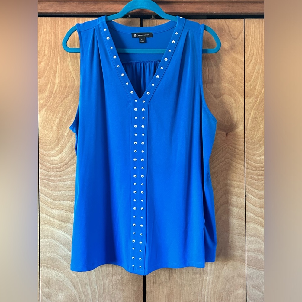 Blue, sleeveless summer top.
